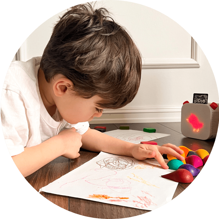 boy coloring on floor